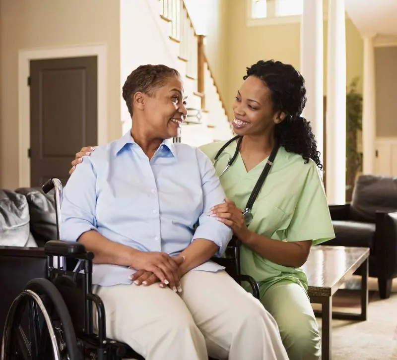 A nurse and a patient in a wheelchair